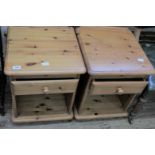 A pair of modern pine bedside chests of drawers