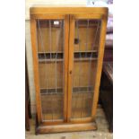 A 1920's Art Deco lead lined glass bookcase