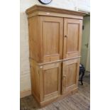 An early 19th Century four door pine cupboard