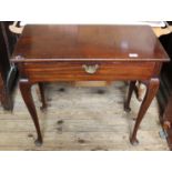 A Victorian mahogany converted tea table with single drawer on cabriole legs