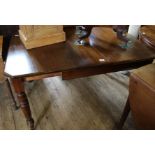 A late Victorian extending mahogany dining table