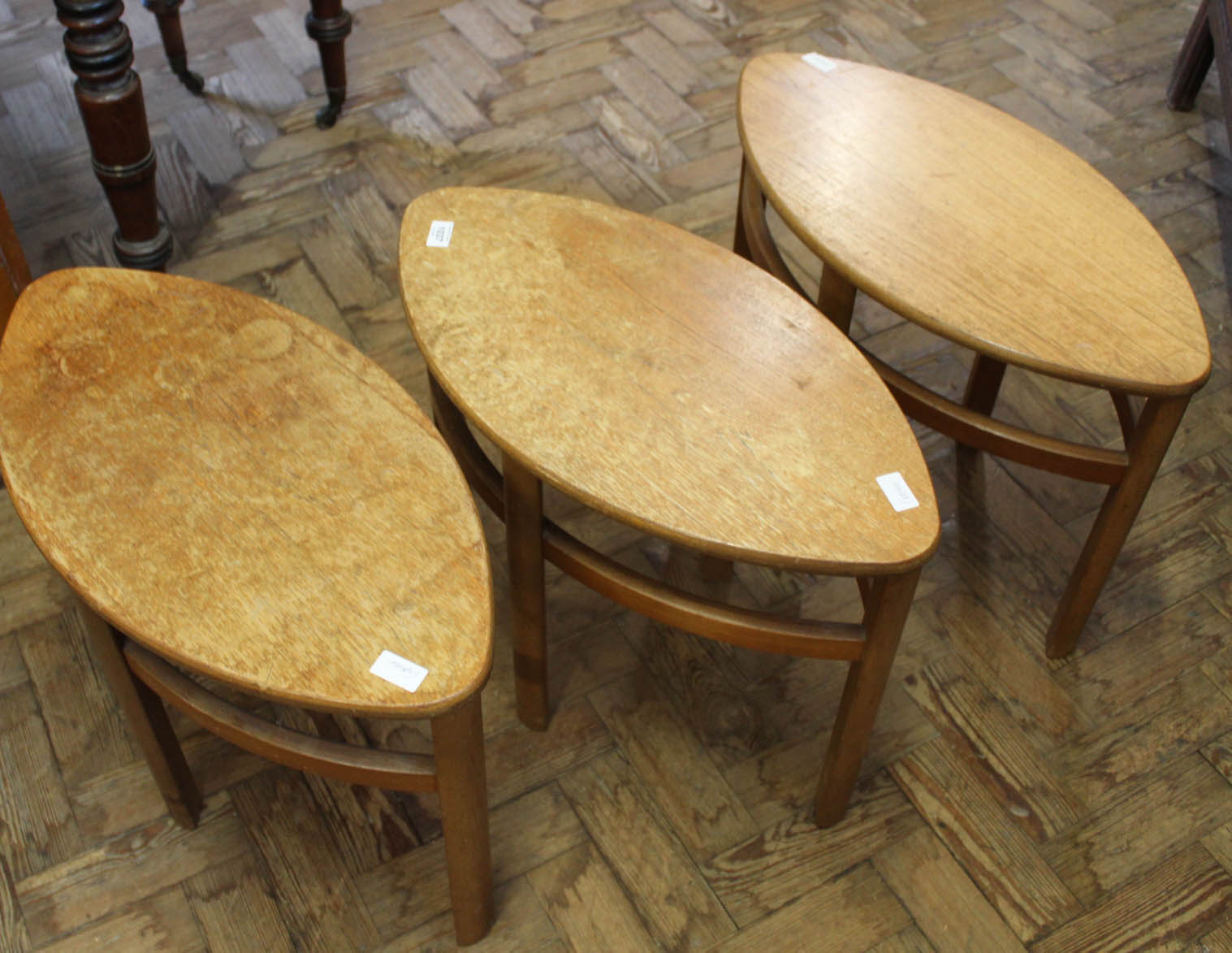 Three 1960's style teak elliptical occasional tables