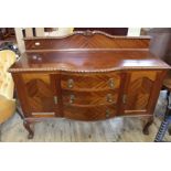 An Edwardian mahogany three drawer,