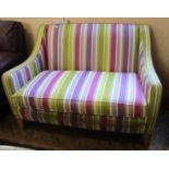 A modern Multiyork two seater sofa in bright striped upholstery