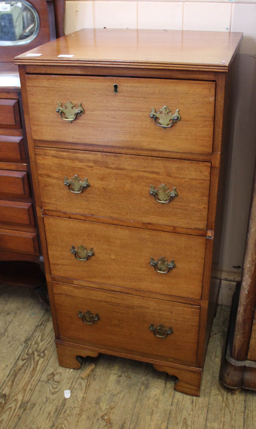 A Georgian style four drawer chest