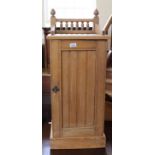 An Edwardian ash pot cupboard with carved upstand