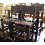 A set of eight oak and leather dining chairs including two carvers
