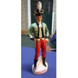 A ceramic figure of a soldier with plinth marked 'Irish Mist Irelands Legendry Liqueur',
