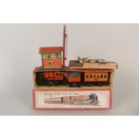 Boxed British tin plate mechanical engine, tender and coach,