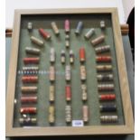 A modern 'cartridge display board' using Government issue shotgun cartridges (many WWII period),