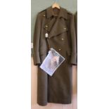 A WWII era Officers greatcoat with Norfolk Regiment buttons and Captains 'pips',