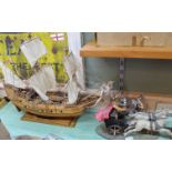 A wooden model galleon plus a Roman charioteer group