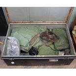 A large tin trunk containing various items of British military clothing and kit