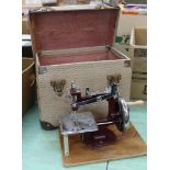 A cased childs sewing machine