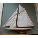 A wooden model pond yacht,