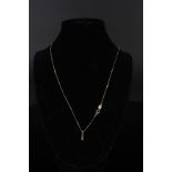 A 14ct gold diamond pendant on 14ct gold chain