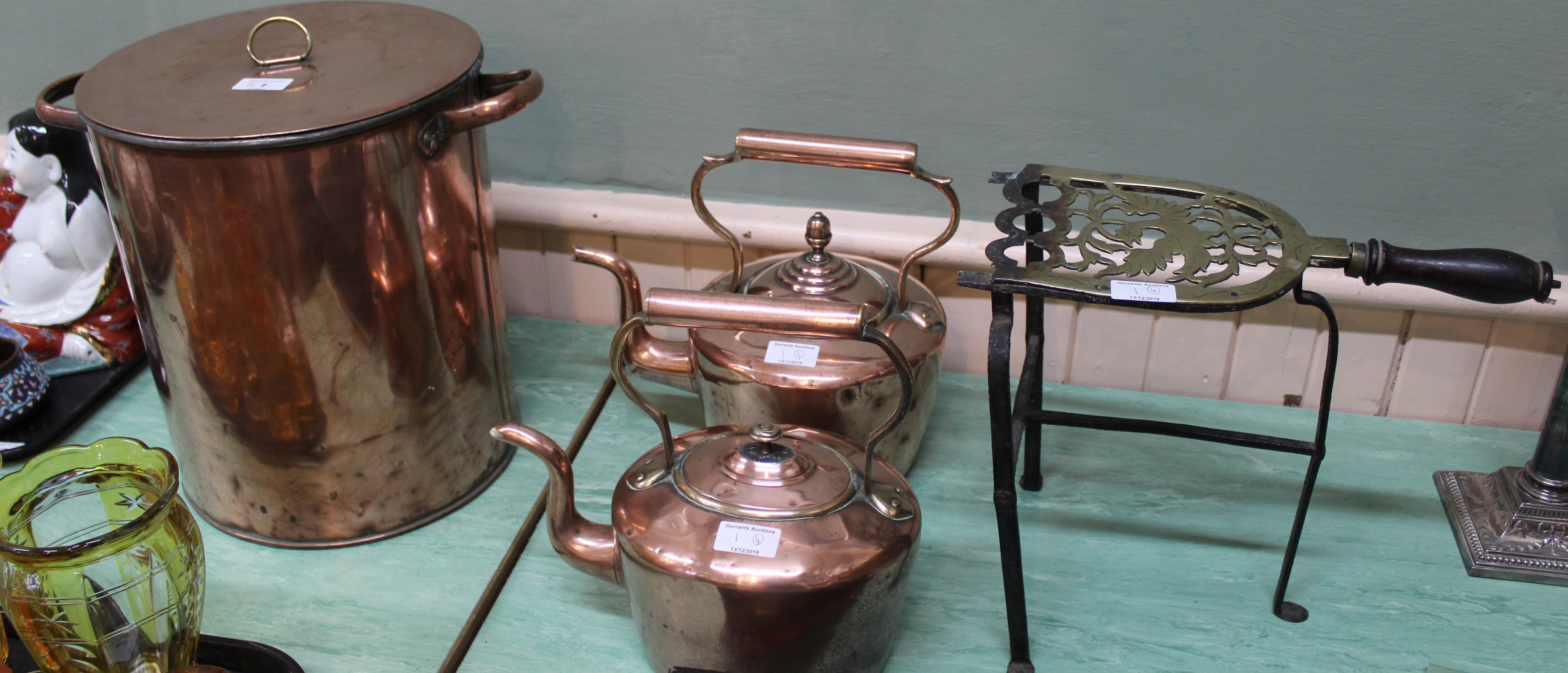 An early 20th Century copper hot water urn with brass tap,