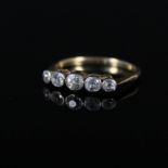 An 18ct gold five stone diamond ring, the five graduating old cut diamonds in collet setting,