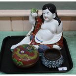 A Chinese porcelain seated Buddha,