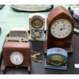 An Edwardian inlaid mahogany mantel clock plus various others and four caricature prints