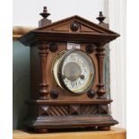 A mahogany striking mantel clock