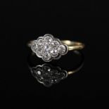 An 18ct platinum set diamond cluster ring,