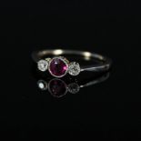 An 18ct and platinum ruby and diamond three stone ring,