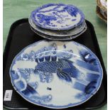 A Japanese carp decorated plate plus three others (two Chinese) (two as found)
