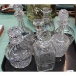 Six various cut glass decanters plus a claret jug