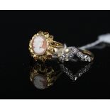 A 9ct gold cameo set ring with pierced sunburst style setting together with a 9ct gold wishbone