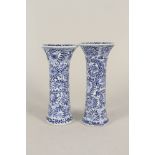 A pair of 19th Century Chinese blue and white floral flared neck vases,