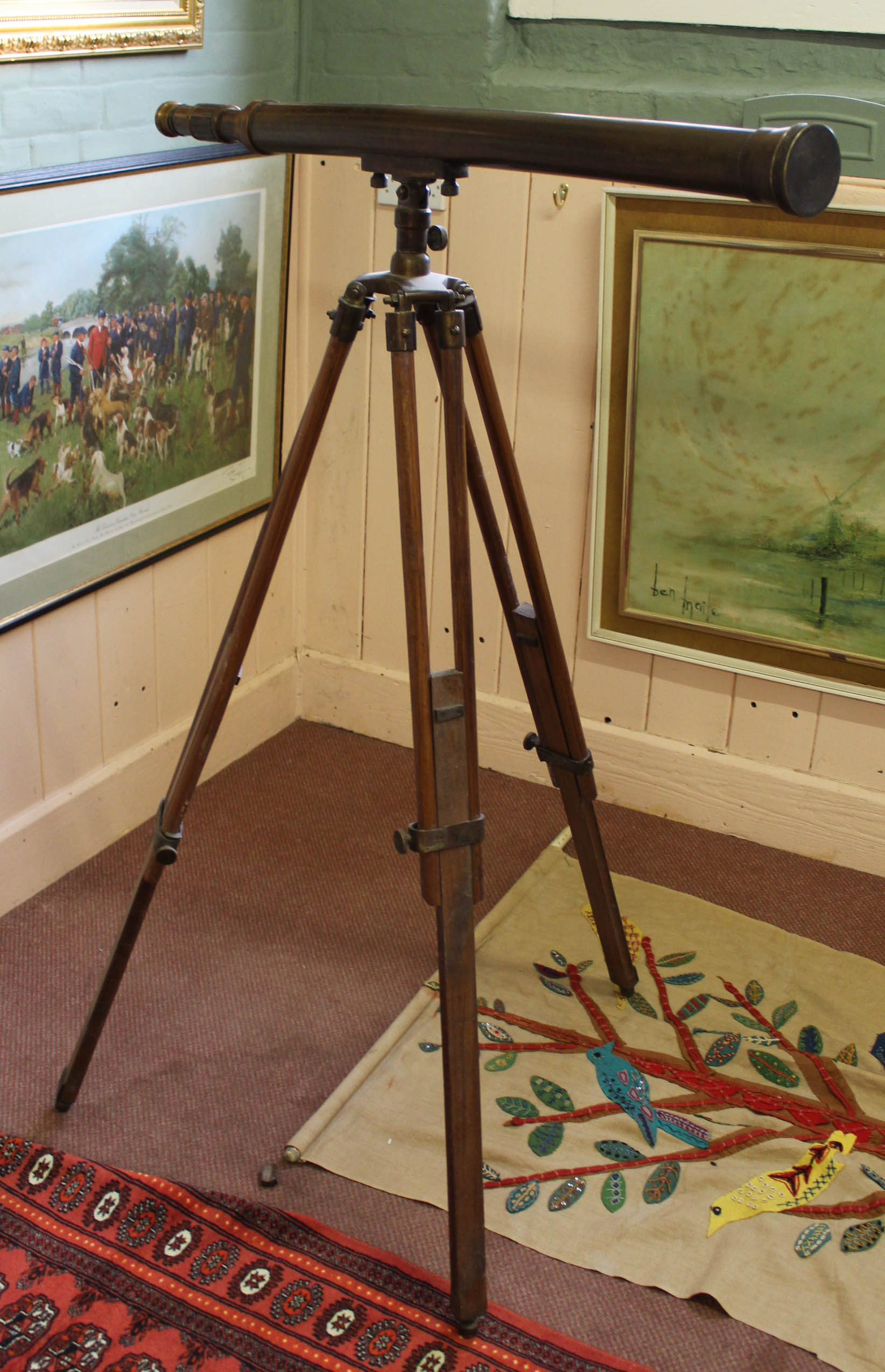 A brass telescope on wooden tripod from the Peninsula Hotel Hong Kong