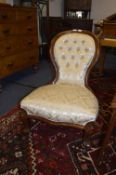Victorian Mahogany Framed Nursing Chair with Golden Buttoned Upholstery
