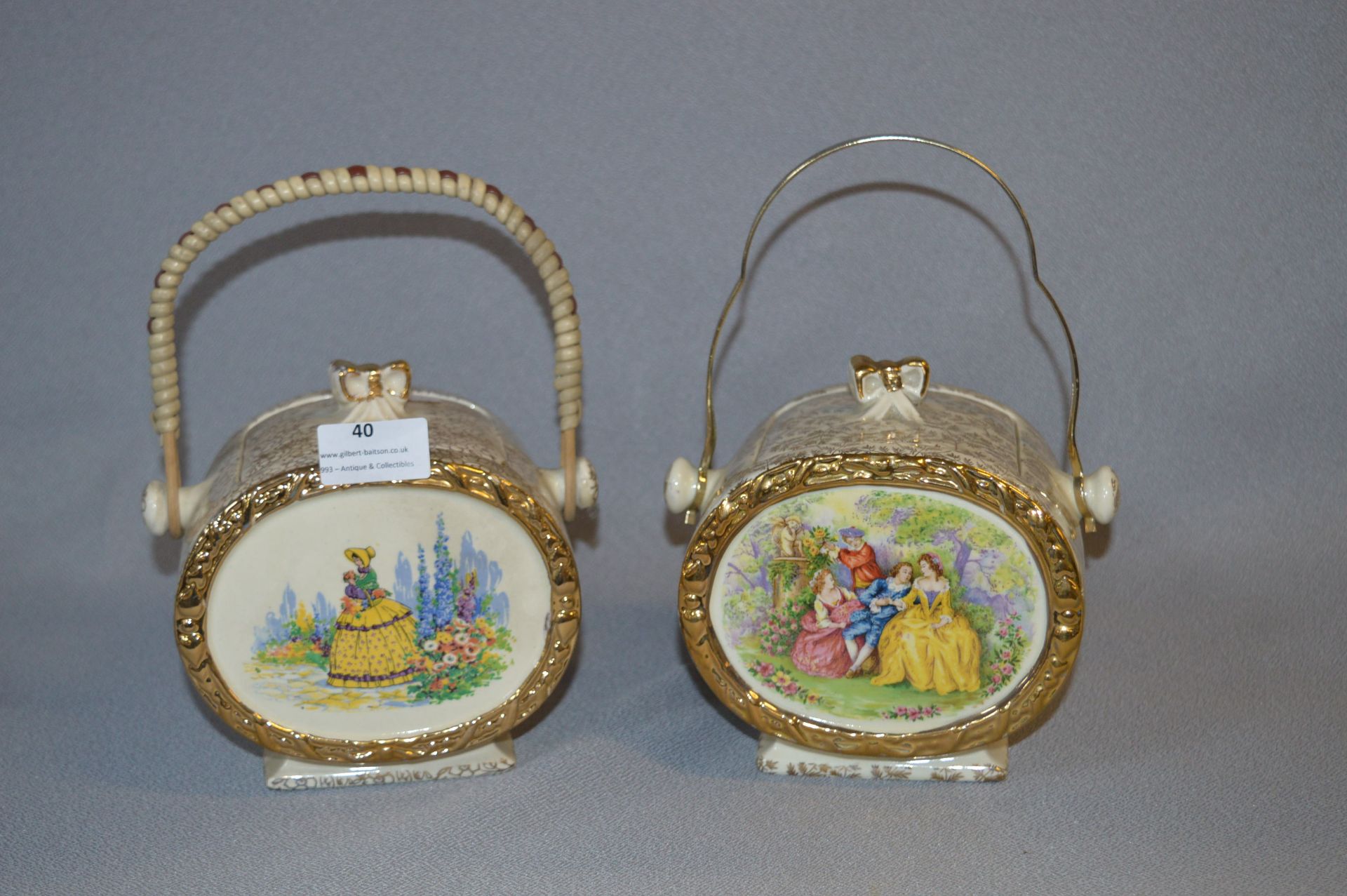 Two Gilt Decorated Pottery Biscuit Barrels with Crinoline Lady Decoration