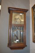 Oak Cased Wall Clock with Bevelled Glass Panels