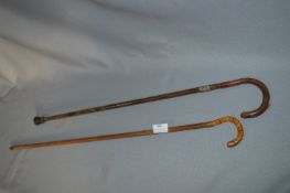 Coloured Glass Handled Walking Stick and a Silver Banded Walking Stick