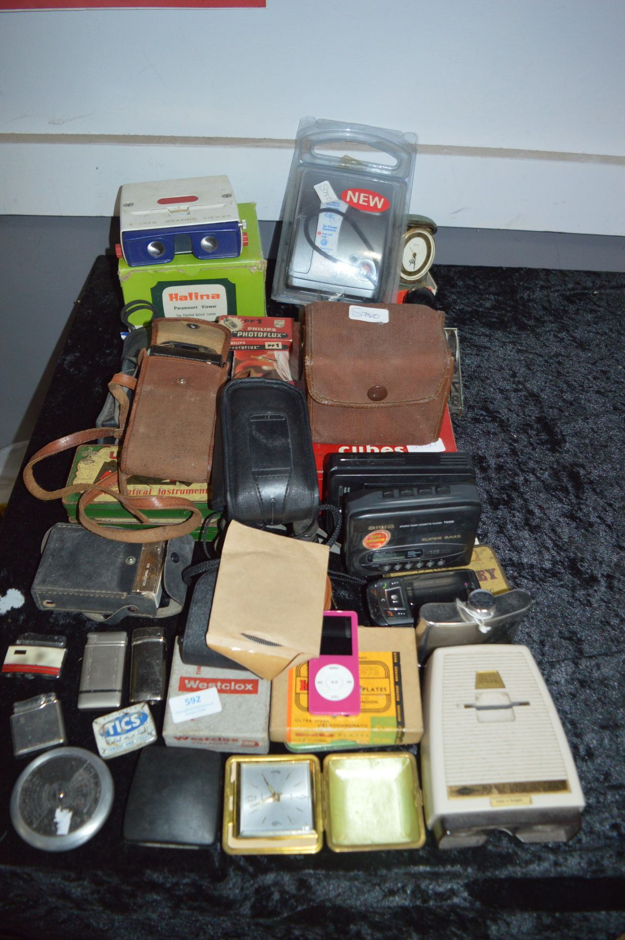 Large Quantity of Collectibles; Travel Clocks, Cameras, Lighters,