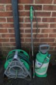 Garden Hose on Reel and a Hozelock Pressure Pump