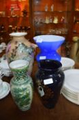 Three Decorative Pottery Vases and a Blue Glass Va