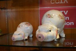 One Large and One Small Pottery Piggy Banks