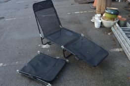 Two Black Mesh Folding Chairs