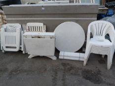Six Stackable Plastic Chairs, Two Plastic Tables a