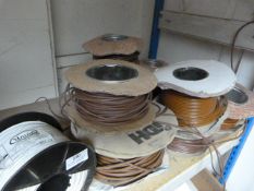 *Nine Small Spools of Brown and One Spool of White