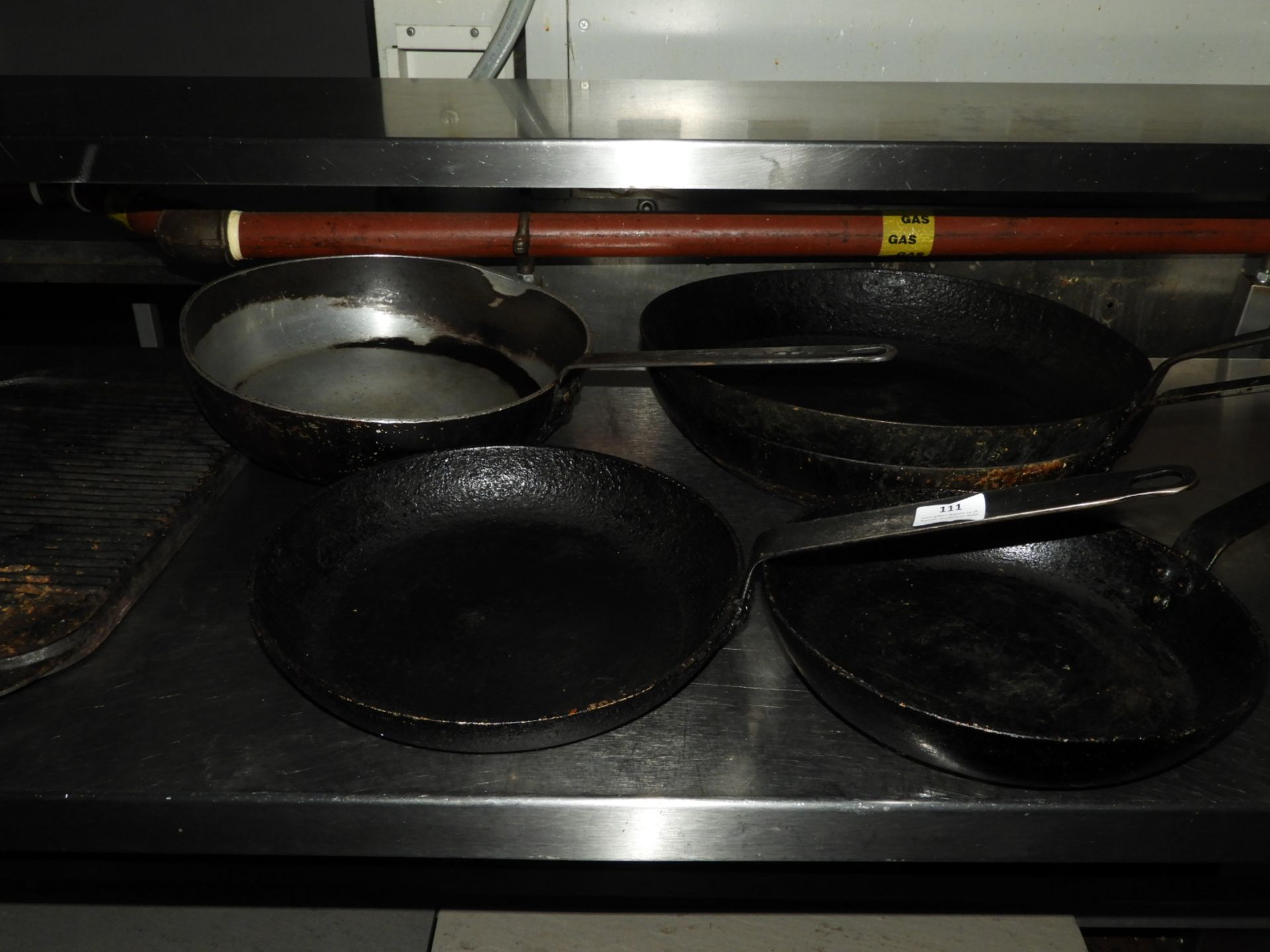 *Five Assorted Black Iron Frying Pans and a Griddl