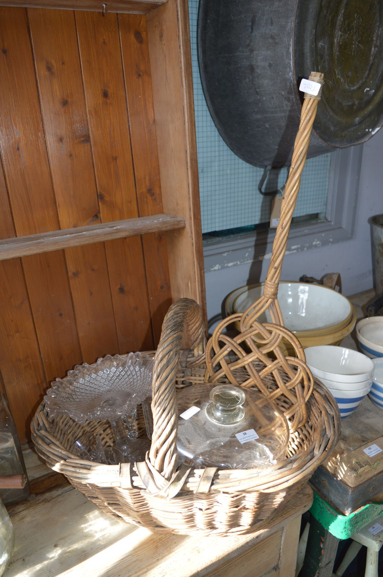 Basket Containing Assorted Glassware and a Carpet Beater
