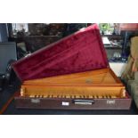 Cased Musical Instrument with Keyboard and Strings