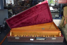 Cased Musical Instrument with Keyboard and Strings