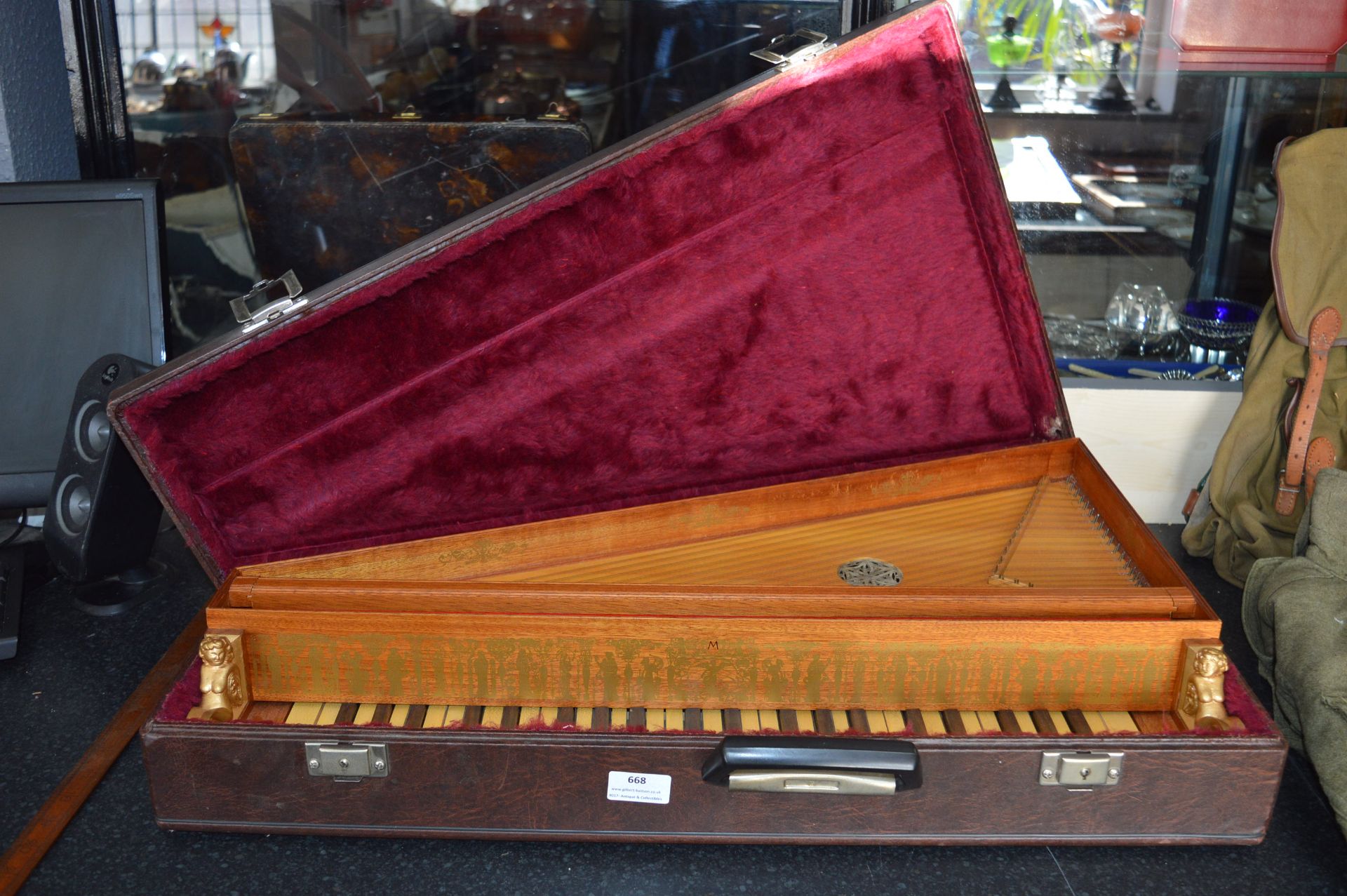 Cased Musical Instrument with Keyboard and Strings