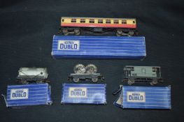 Four Boxed Hornby Dublo Wagons and a Carriage