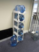Six Bottles of Mineral Water and a Storage Rack